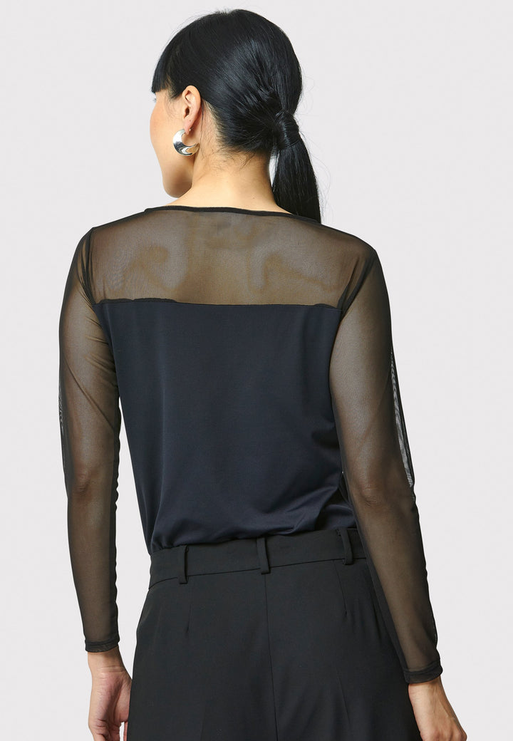 A signature hmca piece. our perennial best-seller back in black. This versatile top features a flattering mesh yoke and sleeves on a snug jersey body. Perfect underpinning to suiting or a more casual pant. Designed by Helen McAlinden in Ireland and made to last in Europe.