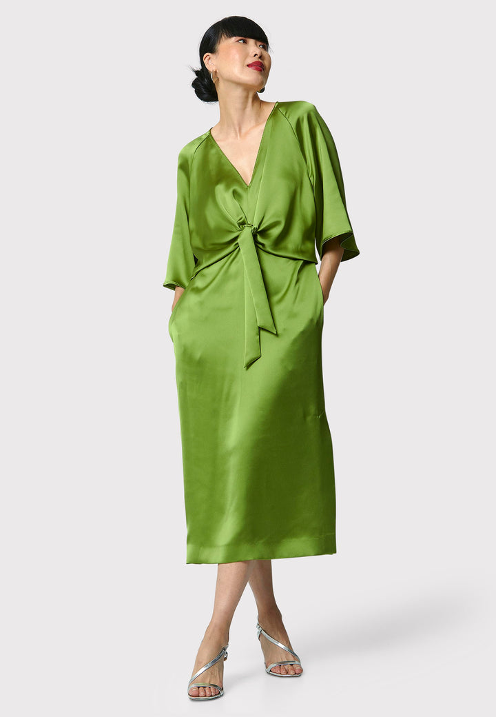 Showcase your grace and elegance with the Ailbhe Chartreuse Green Dress. The luxurious satin material drapes beautifully, while the front ties add sophistication. With practical side seam pockets and an alluring side slit, this mid-calf dress is the perfect choice for any event. Elevate your style with this modernized twist on classic occasionwear.