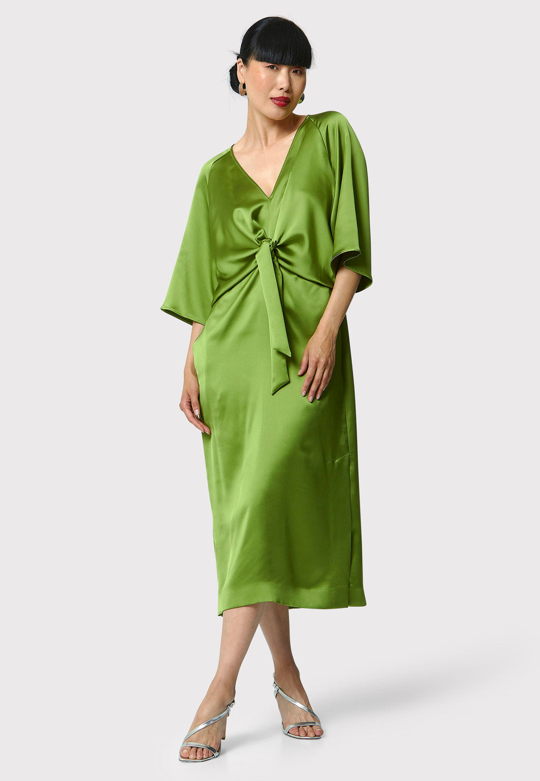 Showcase your grace and elegance with the Ailbhe Chartreuse Green Dress. The luxurious satin material drapes beautifully, while the front ties add sophistication. With practical side seam pockets and an alluring side slit, this mid-calf dress is the perfect choice for any event. Elevate your style with this modernized twist on classic occasionwear.