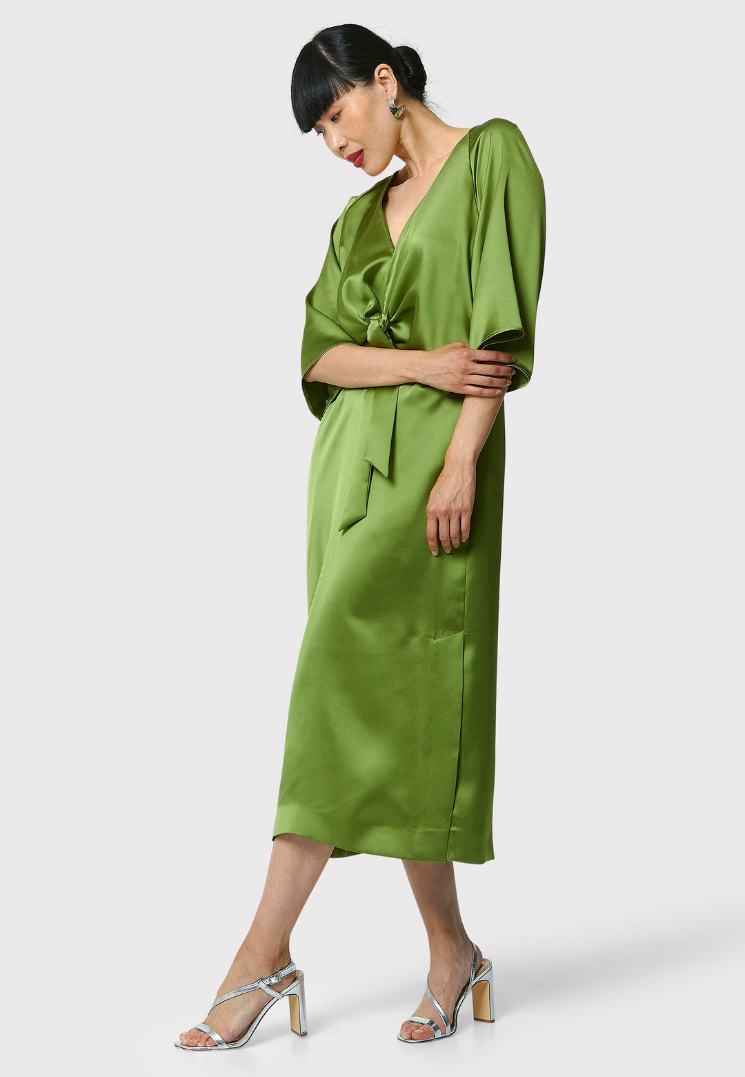 Showcase your grace and elegance with the Ailbhe Chartreuse Green Dress. The luxurious satin material drapes beautifully, while the front ties add sophistication. With practical side seam pockets and an alluring side slit, this mid-calf dress is the perfect choice for any event. Elevate your style with this modernized twist on classic occasionwear.