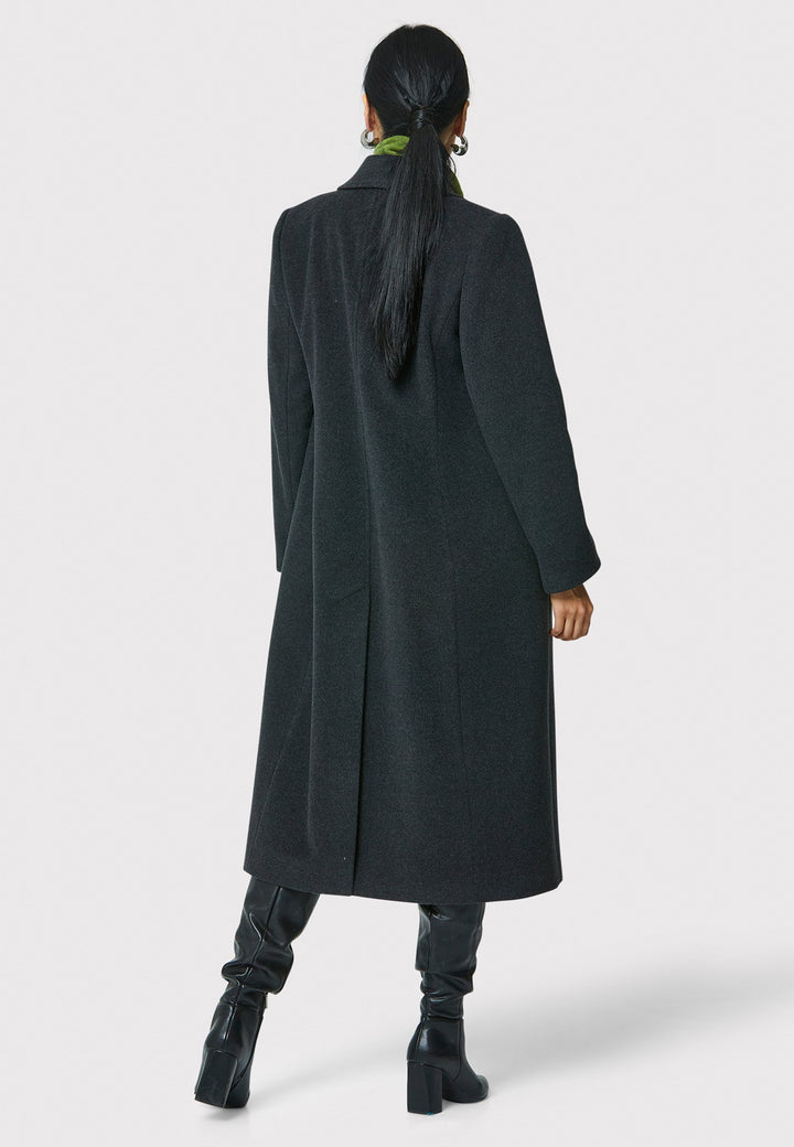 The Beryl charcoal grey coat is crafted from a luxurious wool and cashmere melton blend. This fitted double-breasted coat features peak lapels, simple side seam pockets, and an overlapping back slit. Perfect for both professional and casual settings, this versatile coat is a stylish wardrobe essential.