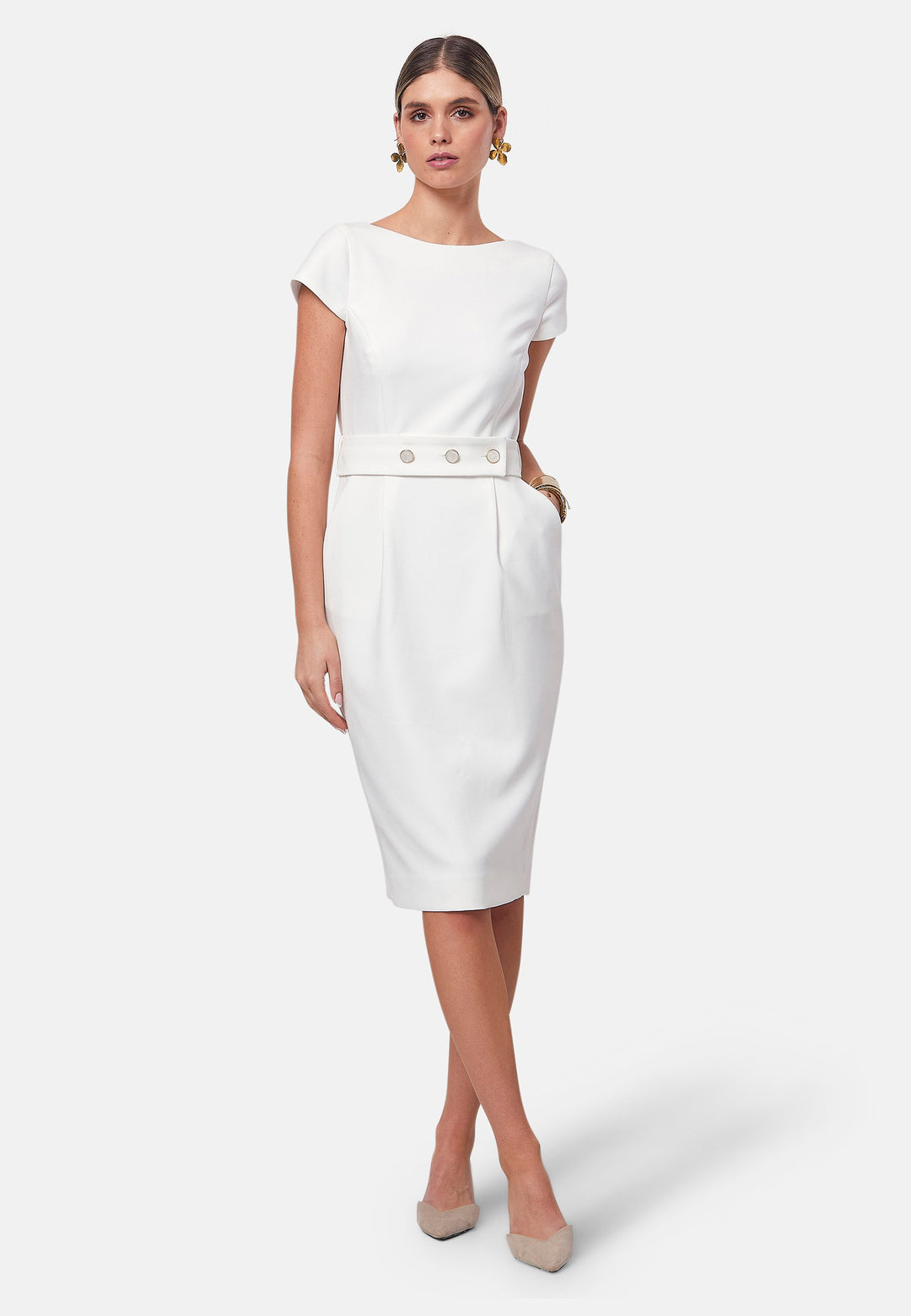 Bianca, a capped-sleeve dress featuring a slash neck and pencil skirt silhouette. Accompanied by a detachable belt featuring gold trimmed pearlescent buttons for the option of a more cinched waistline. Crafted from our signature tricotine with a touch of elastane, ensuring both comfort and movement whilst maintaining a flattering structure. Pair with a trench coat and heels for a chic look.