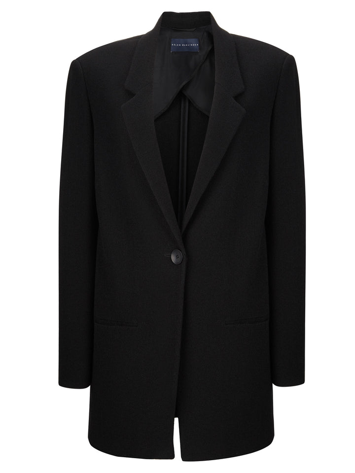 Long line, straight fit tailored jacket. This versatile piece works in many ways. Inspired by men’s tailoring. Easy fit stretch fabric. Mega flattering &amp; comfortable, Fabricated here in true black.