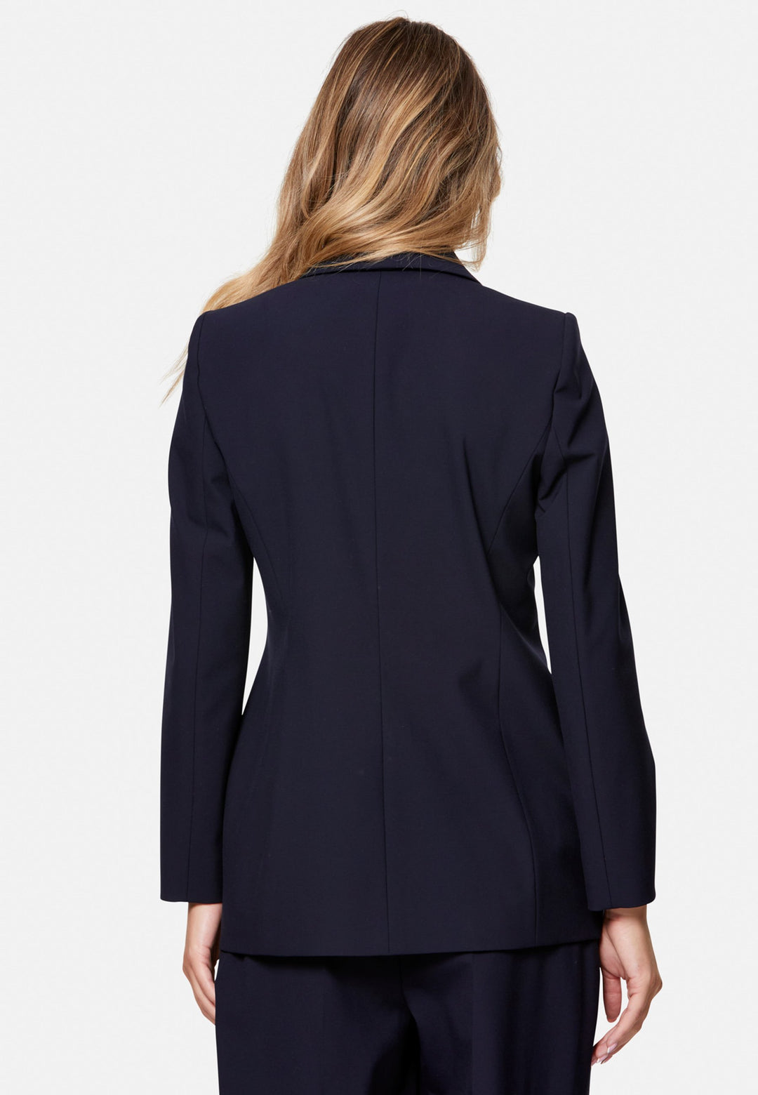 Darcie, the wear-everywhere blazer. Single-breasted with a tonal one-button fastening, tuxedo-inspired shawl collar and neat welt pockets. Cut to a longline, semi-fitted silhouette that flatters over dresses or trousers. Pair with the coordinating Lyra trousers for a modern suit, or throw on with denim at the weekend.