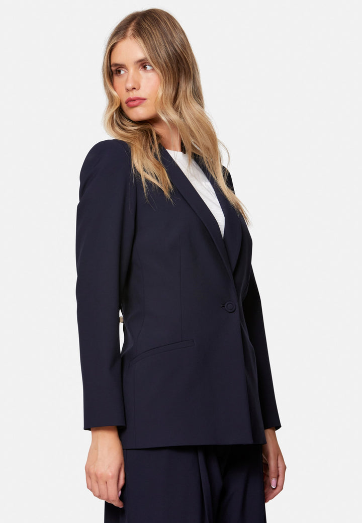 Darcie, the wear-everywhere blazer. Single-breasted with a tonal one-button fastening, tuxedo-inspired shawl collar and neat welt pockets. Cut to a longline, semi-fitted silhouette that flatters over dresses or trousers. Pair with the coordinating Lyra trousers for a modern suit, or throw on with denim at the weekend.