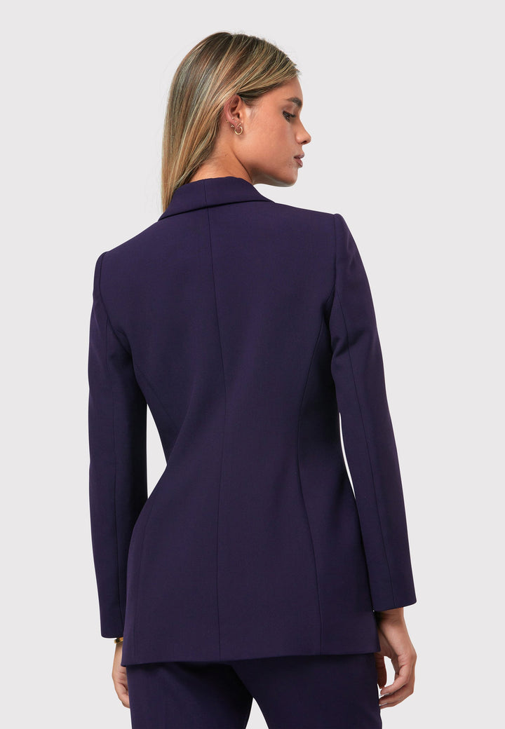 Introducing the Darcie Twilight Plum Jacket, a timeless expression of elegance. This impeccably tailored tuxedo jacket features a seamless shawl collar and welt pockets for a classic touch. The semi-fitted silhouette is enhanced by a single-button closure, ensuring a flattering and sophisticated look. Crafted from our signature tricotine with a hint of stretch, it promises comfort and ease. Complete your polished ensemble by pairing it with the matching Jill Twilight Plum Trouser.