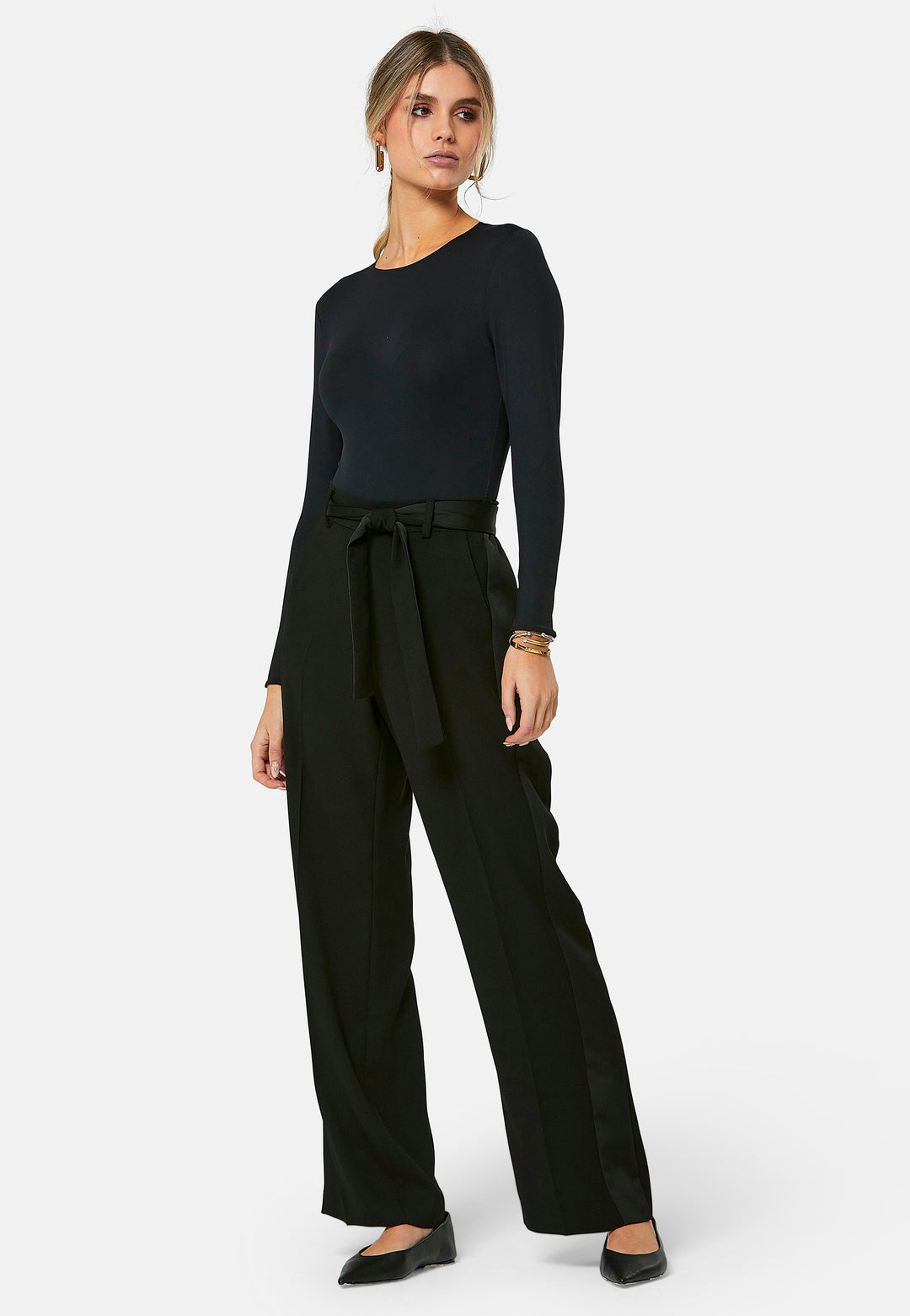 Delilah, Black flat front straight leg trouser with side seam pockets in fluid satin back crepe. Feature a detachable self-fabric belt and a satin stripe along the side seam of the leg. Coordinate with black sparkly tops or matching Lal top for a relaxed take on 'after six' dressing.