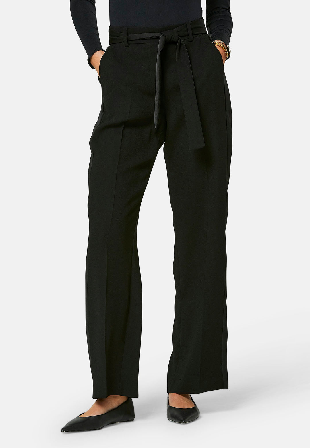 Delilah, Black flat front straight leg trouser with side seam pockets in fluid satin back crepe. Feature a detachable self-fabric belt and a satin stripe along the side seam of the leg. Coordinate with black sparkly tops or matching Lal top for a relaxed take on 'after six' dressing.