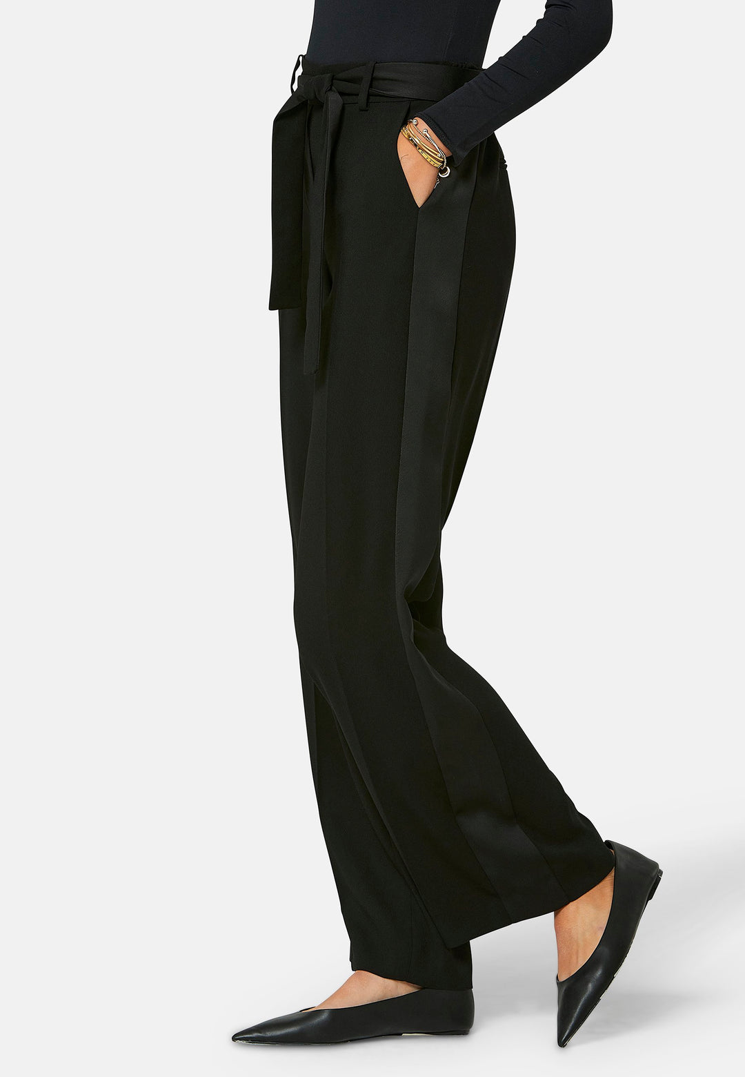 Delilah, Black flat front straight leg trouser with side seam pockets in fluid satin back crepe. Feature a detachable self-fabric belt and a satin stripe along the side seam of the leg. Coordinate with black sparkly tops or matching Lal top for a relaxed take on 'after six' dressing.