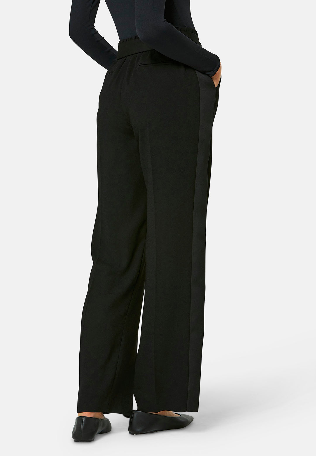 Delilah, Black flat front straight leg trouser with side seam pockets in fluid satin back crepe. Feature a detachable self-fabric belt and a satin stripe along the side seam of the leg. Coordinate with black sparkly tops or matching Lal top for a relaxed take on 'after six' dressing.