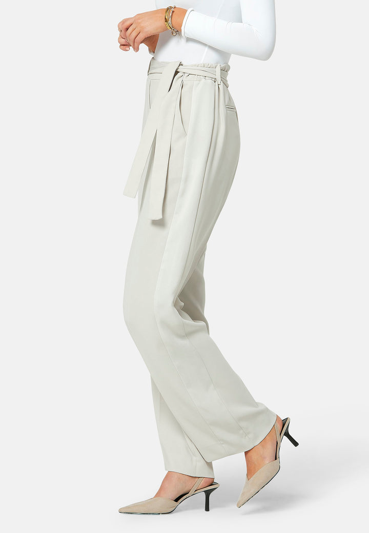 Delilah, Stone flat front straight leg trouser with side seam pockets in fluid satin back crepe. Feature a detachable self-fabric belt and a satin stripe along the side seam of the leg. Coordinate with the white timeless tops or matching Lal top for a relaxed take on 'after six' dressing.