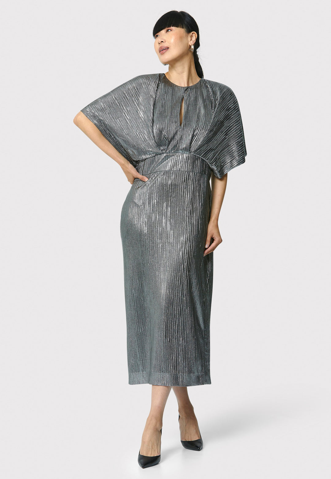 Introducing the Eabha Metallic Silver Dress, crafted from pleated satin for a luxurious feel and graceful flow. The straight skirt is complemented by a side seam slit, practical pockets and a keyhole back detail. Perfect for black-tie weddings and formal events.