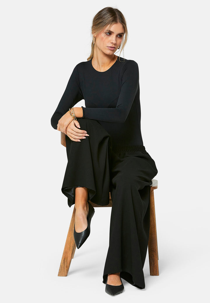 Imogen, black culottes in a fluid satin back crepe. Feature a flowy wide-leg, elasticated waistband and side pockets. A relaxed yet dressy look. Coordinate with black sparkly tops and matching Lydiah trench for a complete outfit.