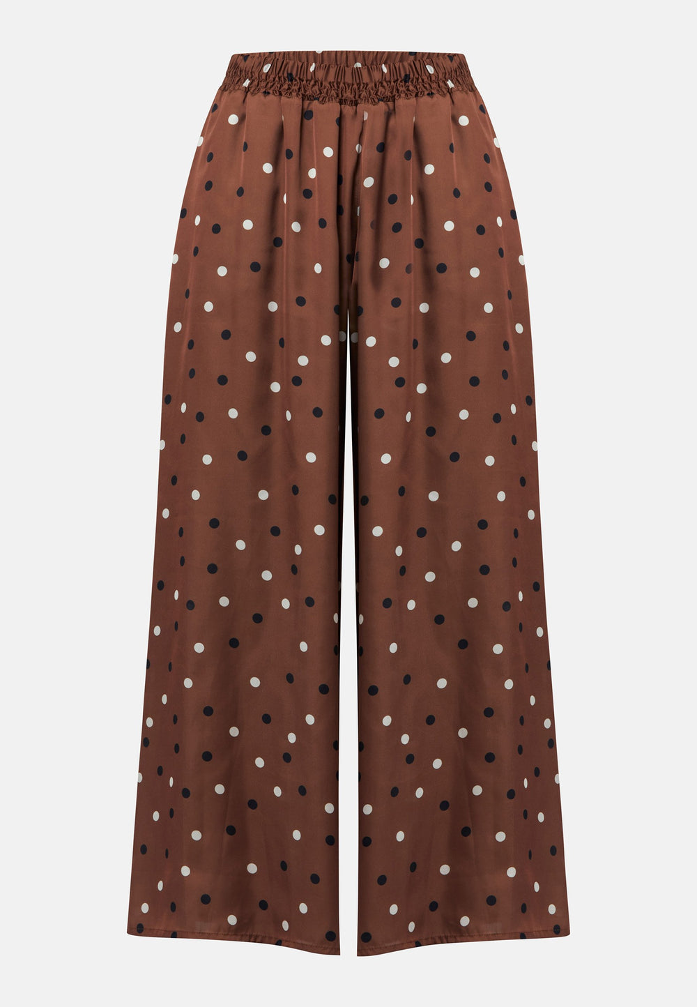 The Imogen wide-leg trousers in a brown base, black and white polkadot print. Prioritizing comfort with an elasticated gathered waistband. The pattern adds a touch of fun to this bestseller silhouette.