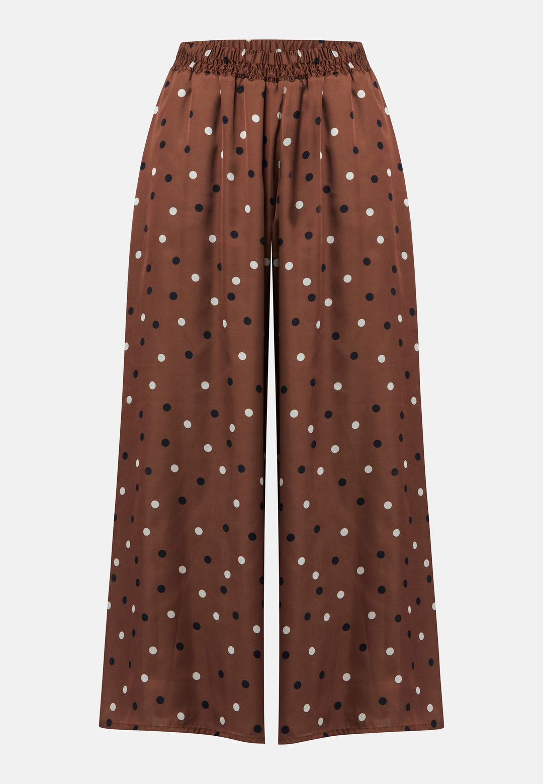 The Imogen wide-leg trousers in a brown base, black and white polkadot print. Prioritizing comfort with an elasticated gathered waistband. The pattern adds a touch of fun to this bestseller silhouette.