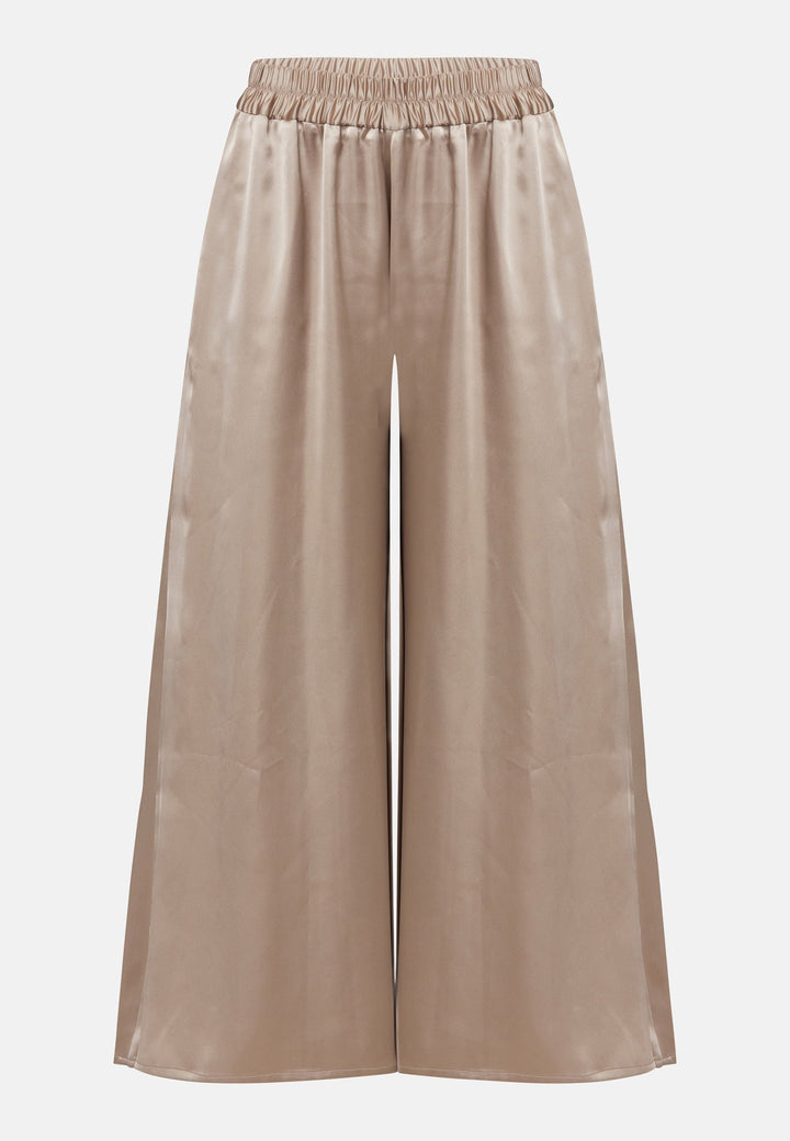 The Imogen Coffee trousers bring chic comfort and versatility to your wardrobe. With a flowing wide leg that elegantly falls to the ankle. These trousers prioritize comfort with an elasticated gathered waistband. Pair this bestselling silhouette with our Berna Coffee top for an elegant co-ord look.