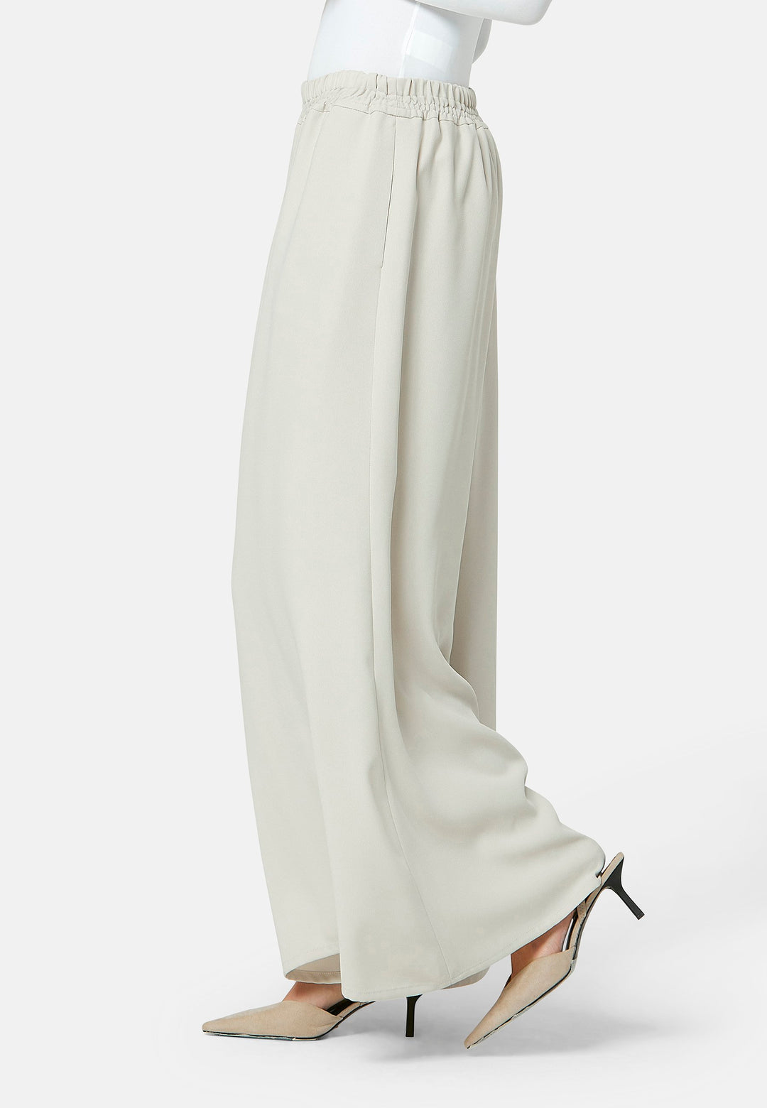 Imogen, Stone culottes in a fluid satin back crepe. Feature a flowy wide-leg, elasticated waistband and side pockets. A relaxed yet dressy look. Coordinate with white timeless tops and matching Lydiah trench for a complete outfit.