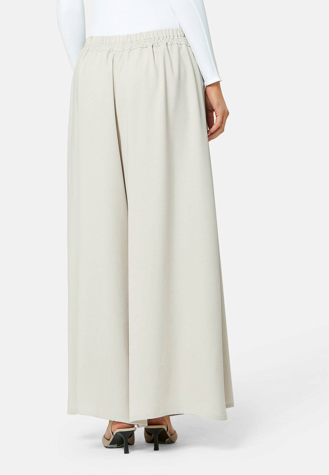 Imogen, Stone culottes in a fluid satin back crepe. Feature a flowy wide-leg, elasticated waistband and side pockets. A relaxed yet dressy look. Coordinate with white timeless tops and matching Lydiah trench for a complete outfit.