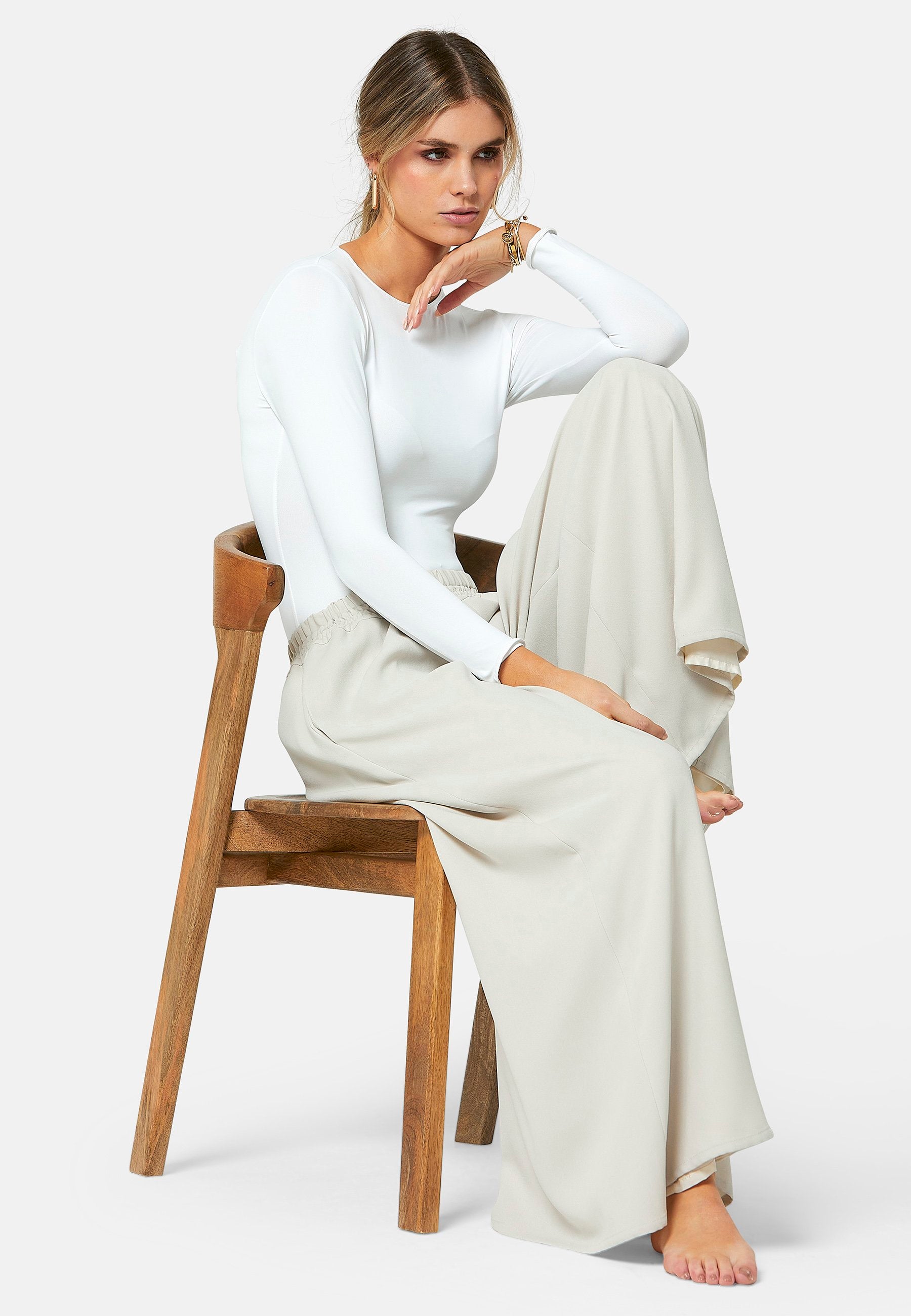 Imogen, Stone culottes in a fluid satin back crepe. Feature a flowy wide-leg, elasticated waistband and side pockets. A relaxed yet dressy look. Coordinate with white timeless tops and matching Lydiah trench for a complete outfit.
