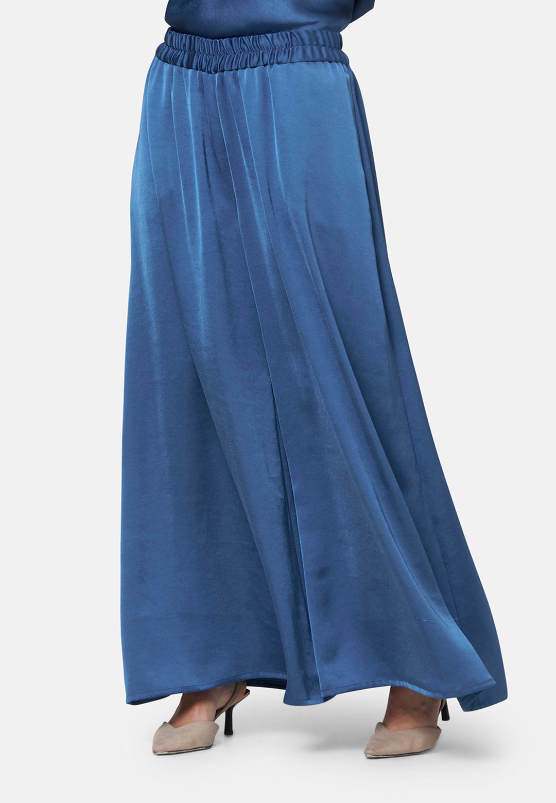 Woman wearing silk-touch satin in storm blue pants