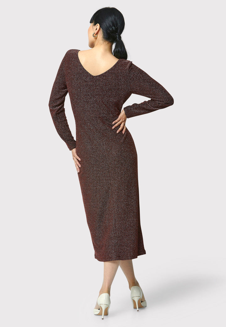 Introducing the Jamie Copper Shimmer Dress, an elegant bodycon piece with full-length sleeves. Made from sparkly black jersey fabric, it features a slash neck with a slight V-back for added allure. Its midi length perfectly balances classic and modern styles. Ideal for any occasion, this dress adds a touch of glamour to your look.