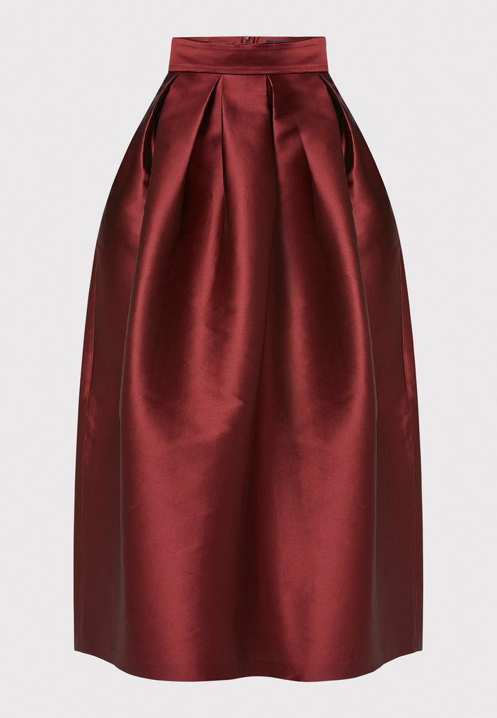 The Kennedy Mahogany Red Skirt is a sophisticated and chic piece inspired by 1950s fashion. This full-length A-line skirt features a structured design that captures the essence of iconic 50s style. Perfect for formal events and black tie weddings, the Kennedy Mahogany Red Skirt offers classic elegance with a modern twist.