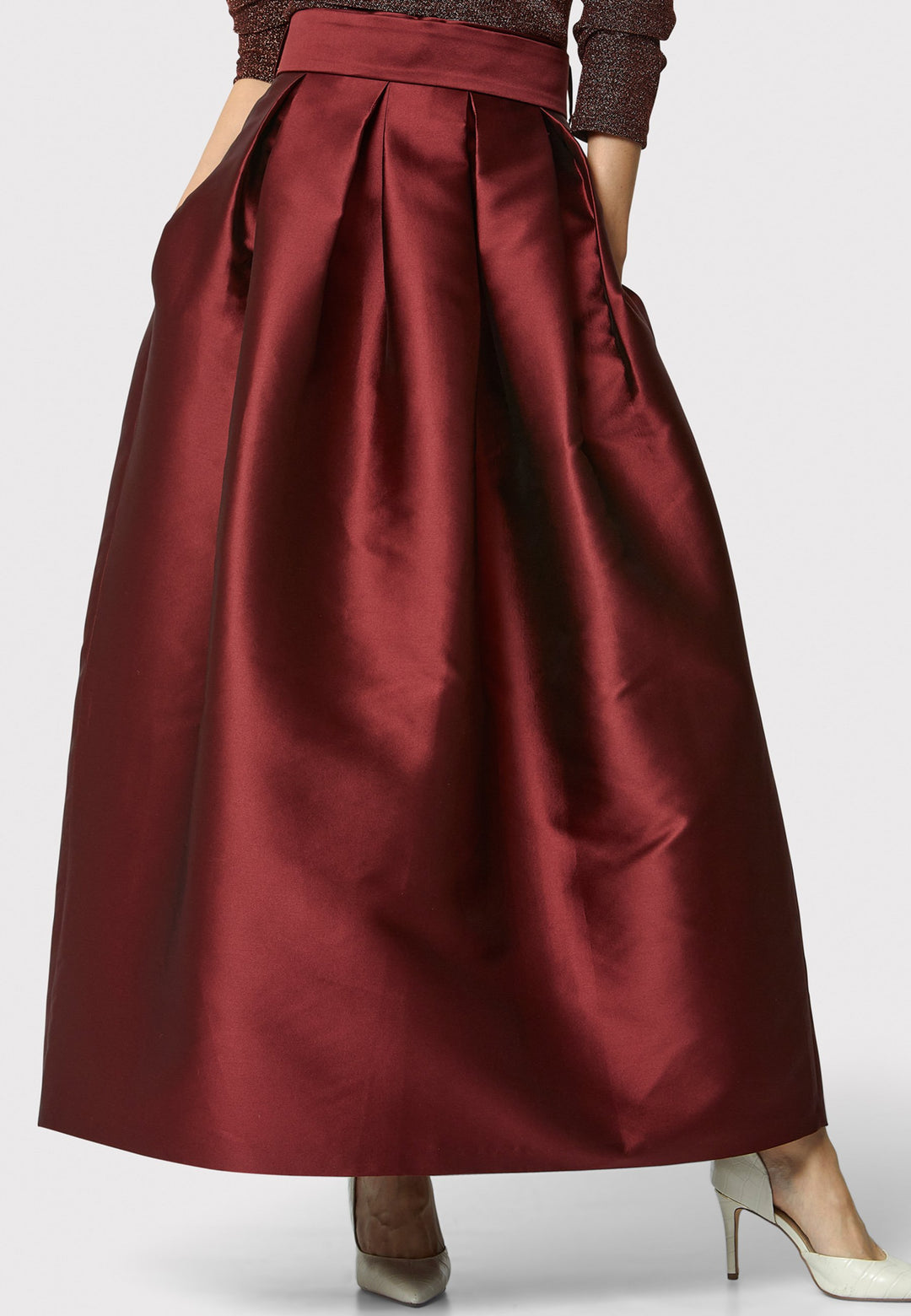 The Kennedy Mahogany Red Skirt is a sophisticated and chic piece inspired by 1950s fashion. This full-length A-line skirt features a structured design that captures the essence of iconic 50s style. Perfect for formal events and black tie weddings, the Kennedy Mahogany Red Skirt offers classic elegance with a modern twist.