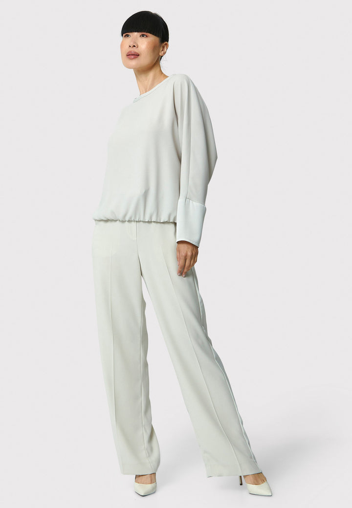 Lal, stone top in fluid satin back crepe. A relaxed fit, elastic waistband, Dropped Shoulder sleeves, and satin cuffs. Wear with the coordinating Deliliah or Imogen Pant.