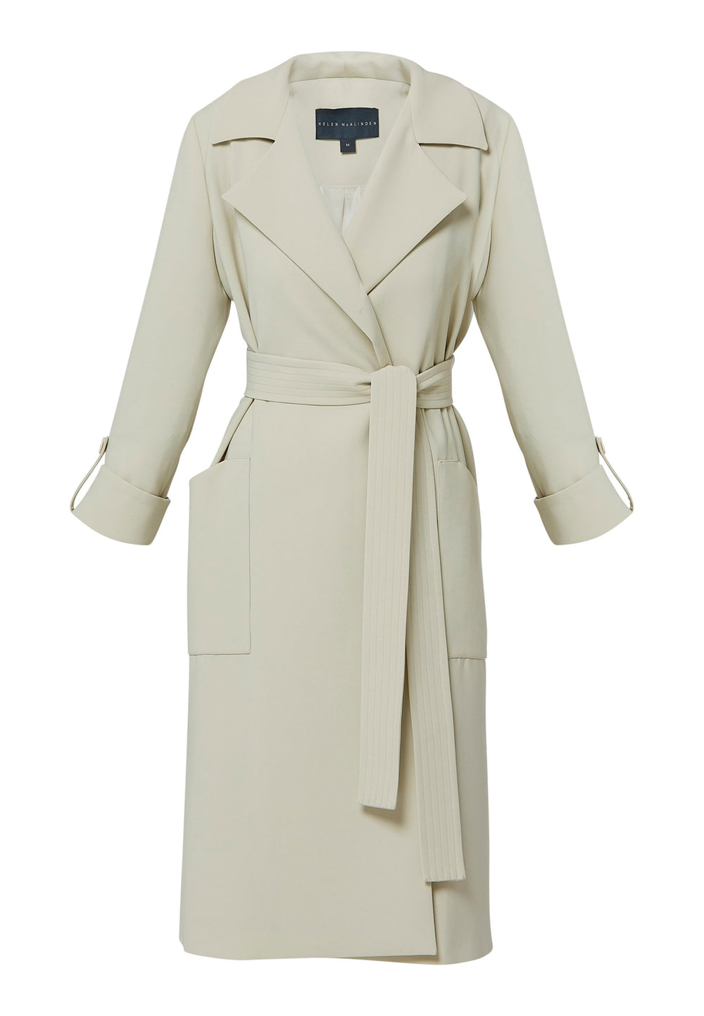 Lydiah, stone trench coat in a fluid satin back crepe. This coat features a relaxed, flowing silhouette, a self-tie belt, and front pockets. The design includes buttoned cuffs and a wide lapel. Pair with coordinating trouser for a chic monochromatic look.