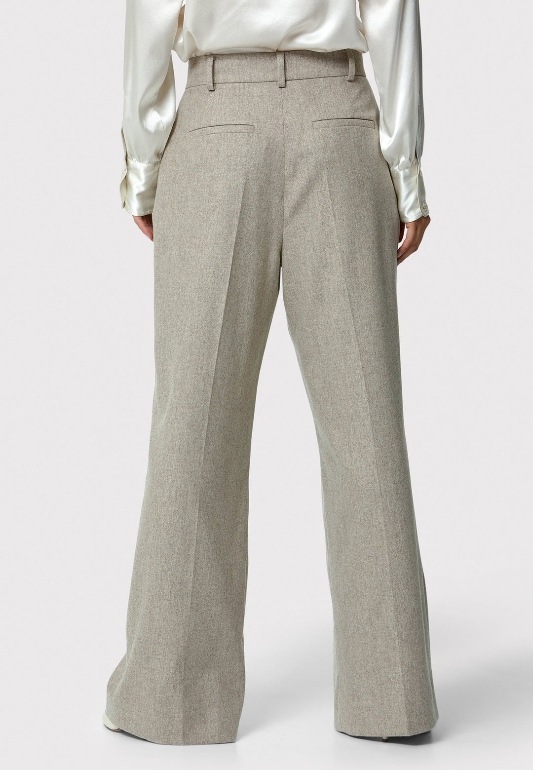 Lyra Trousers in melange mink, crafted from a soft-touch wool blend. This pleated front wide-leg relaxed fit trousers offer a timeless and versatile look suitable for both professional and casual settings. Pair the Anastasia Ivory silk blouse and matching Marlow Jacket for a chic tonal outfit.