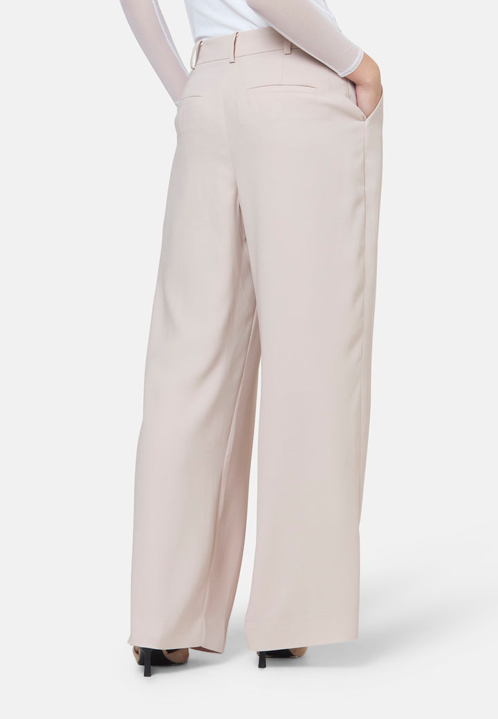 Woman wearing natural pearl pants