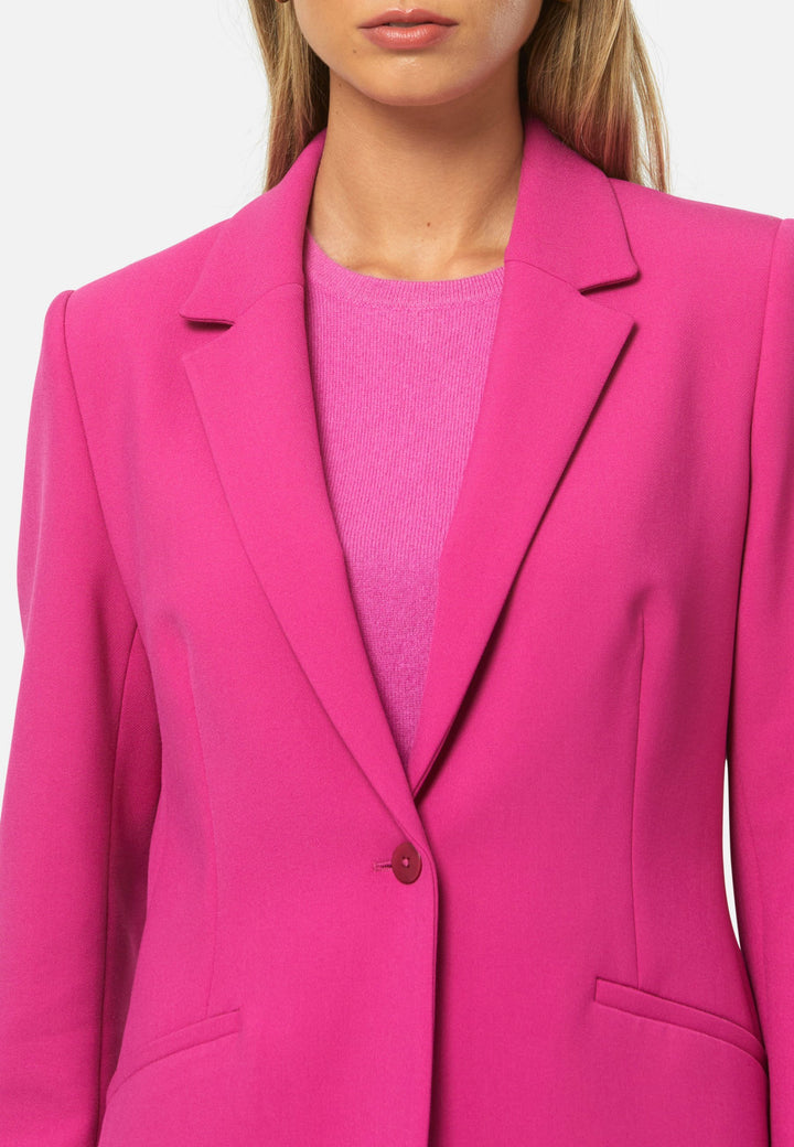 woman wearing pink suit