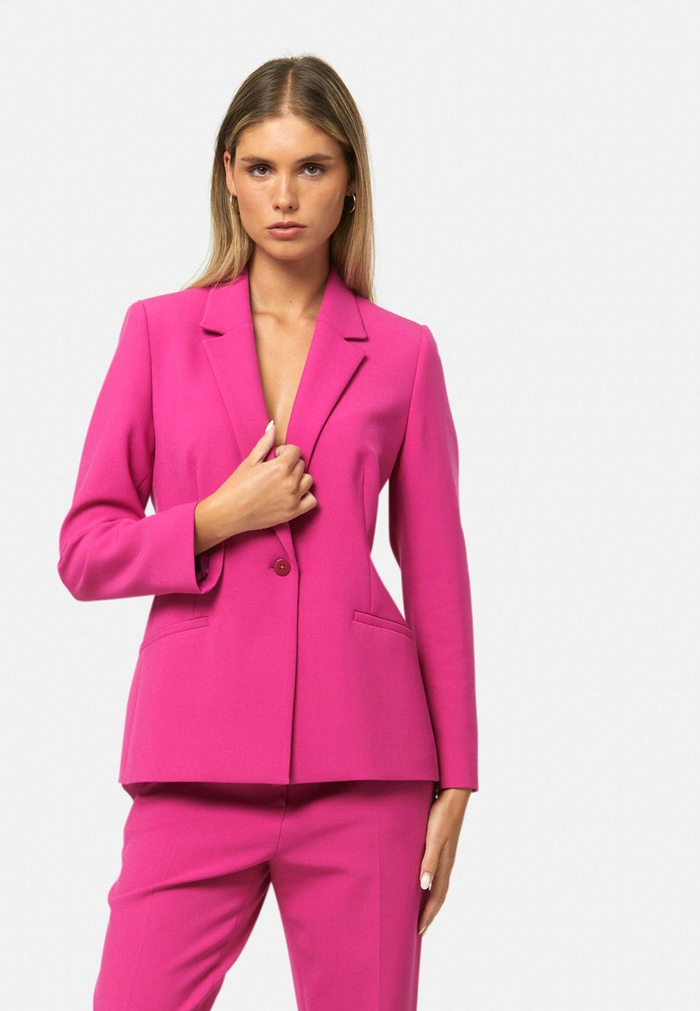 woman wearing pink suit