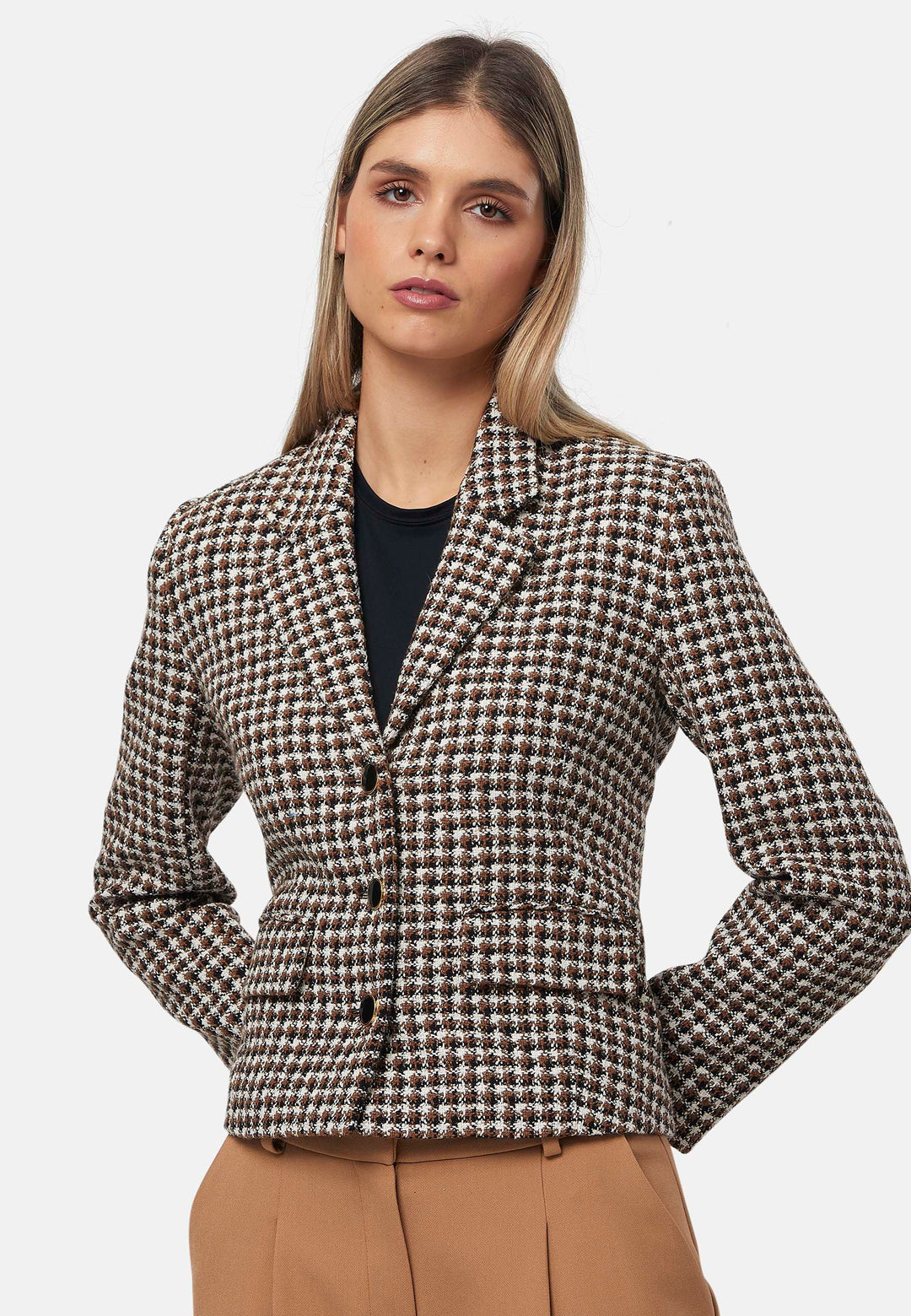 This bouclé tailored blazer features a classic houndstooth pattern in earthy brown, black, and white tones. Designed with a structured fit, it includes a notched lapel, three-button front closure, and flap pockets for a timeless look. Perfect for elevating both office and casual outfits.