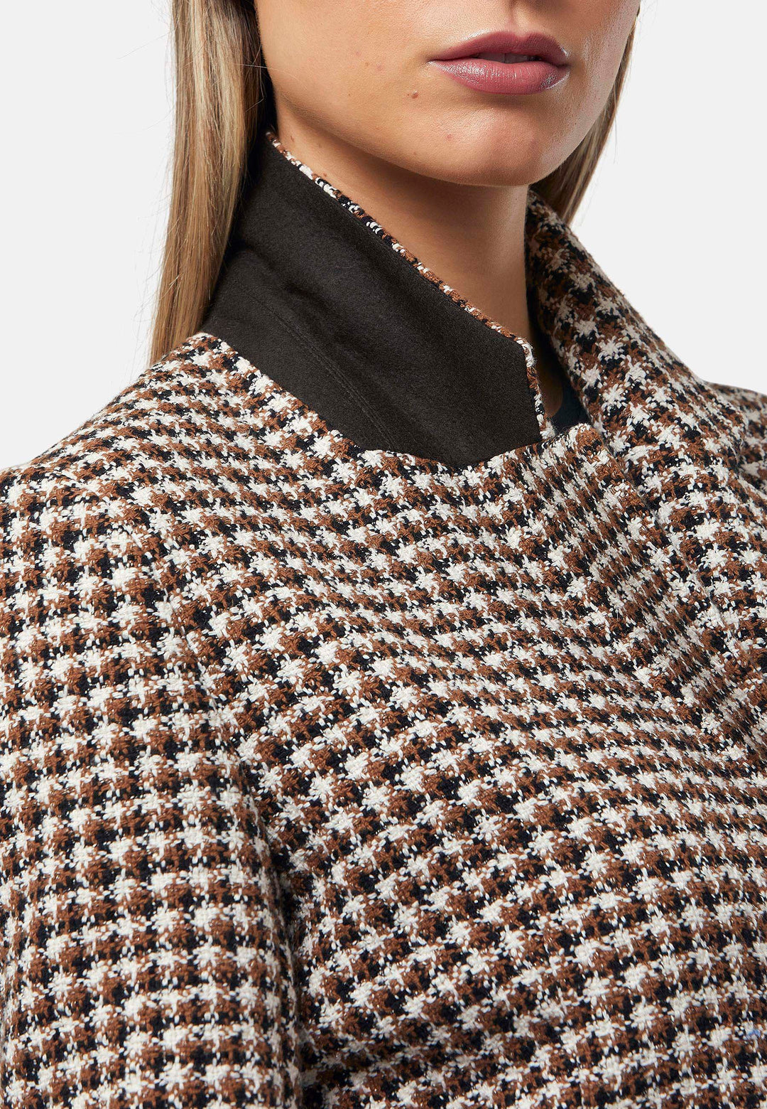 This bouclé tailored blazer features a classic houndstooth pattern in earthy brown, black, and white tones. Designed with a structured fit, it includes a notched lapel, three-button front closure, and flap pockets for a timeless look. Perfect for elevating both office and casual outfits.