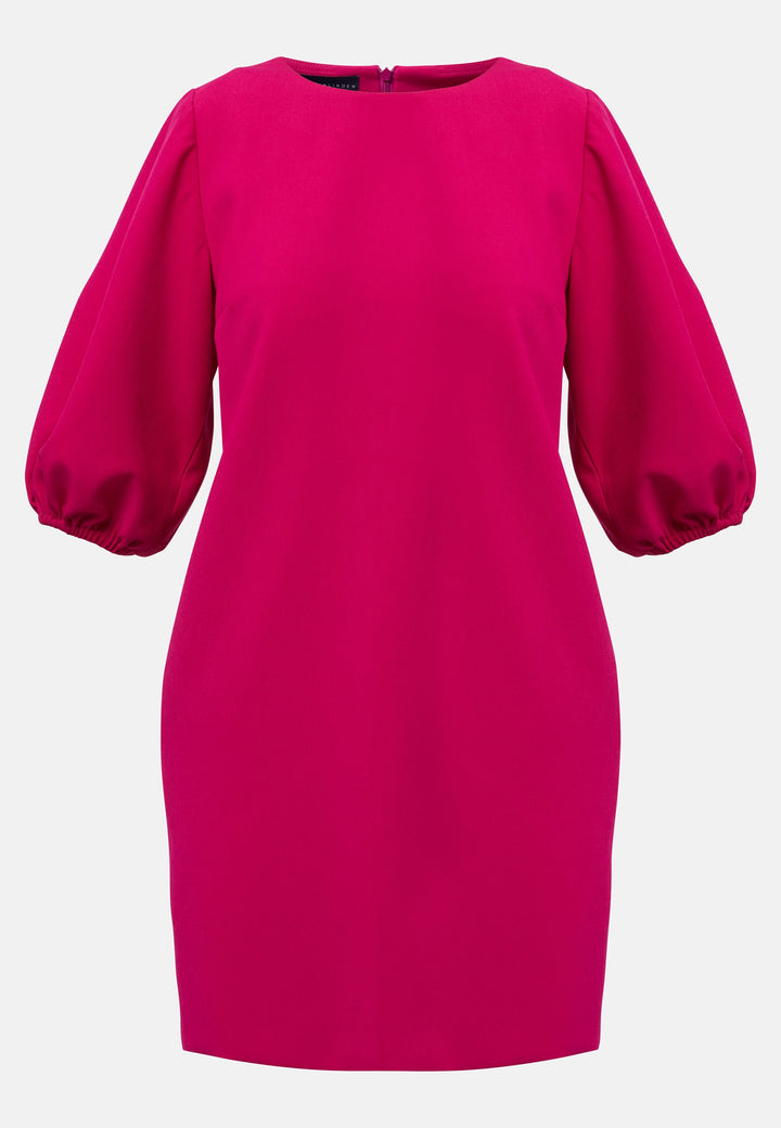 Mila, a chic short-shift dress in bold Fuchsia. This feminine piece features a timeless silhouette with voluminous three-quarter puff sleeves and a round neckline.