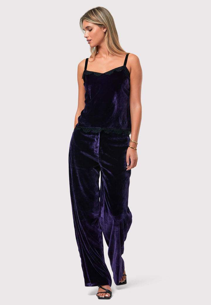 Indulge in luxurious comfort with our twilight plum wide-leg trousers. Flat-front trousers sit perfectly at the natural waist and include side pockets. Made from a premium purple tone velvet, a blend of silk and viscose, they exude elegance and sophistication.