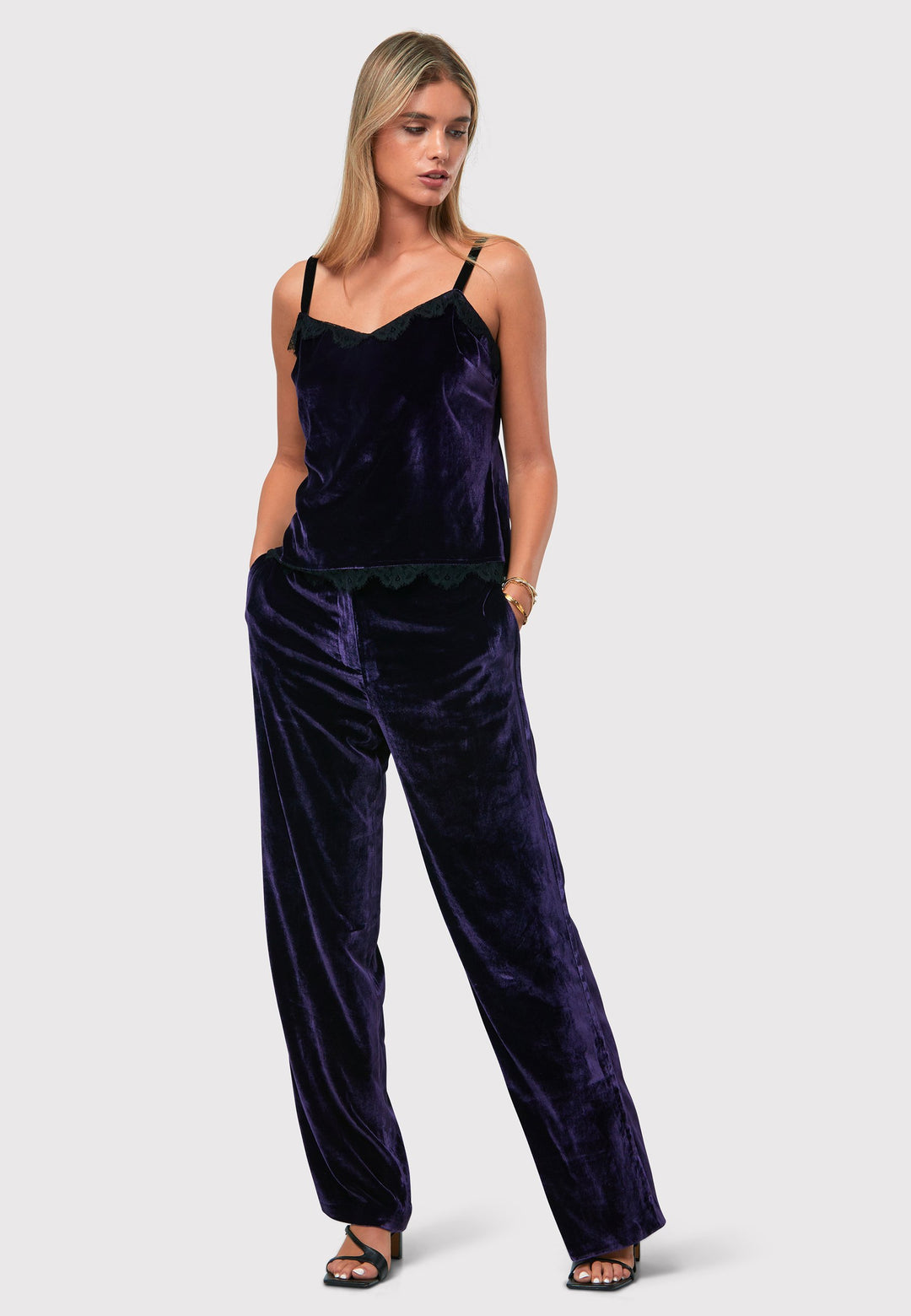 Indulge in luxurious comfort with our twilight plum wide-leg trousers. Flat-front trousers sit perfectly at the natural waist and include side pockets. Made from a premium purple tone velvet, a blend of silk and viscose, they exude elegance and sophistication.