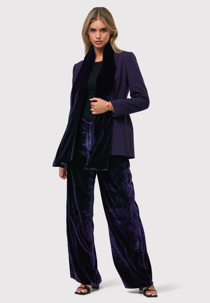 Indulge in luxurious comfort with our twilight plum wide-leg trousers. Flat-front trousers sit perfectly at the natural waist and include side pockets. Made from a premium purple tone velvet, a blend of silk and viscose, they exude elegance and sophistication.