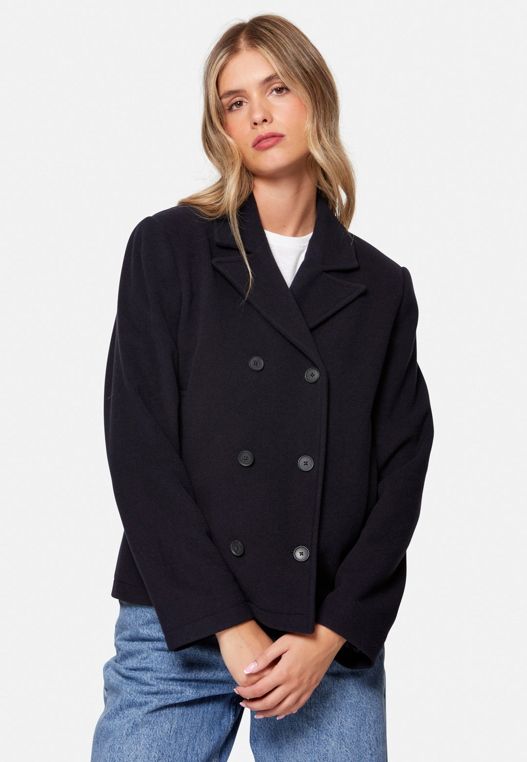 woman wearing double breast cashmere pea coat in navy