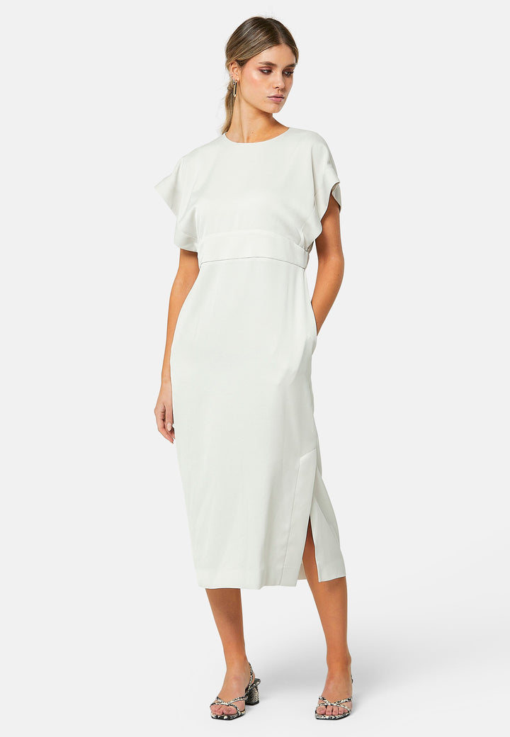 Elevate your wardrobe with Shiv, a simple stone midi dress in a fluid satin back crepe. Featuring dropped sleeves, a gathered back waist seam, and a side slit for ease of movement. The back has a keyhole detail with a button closure.