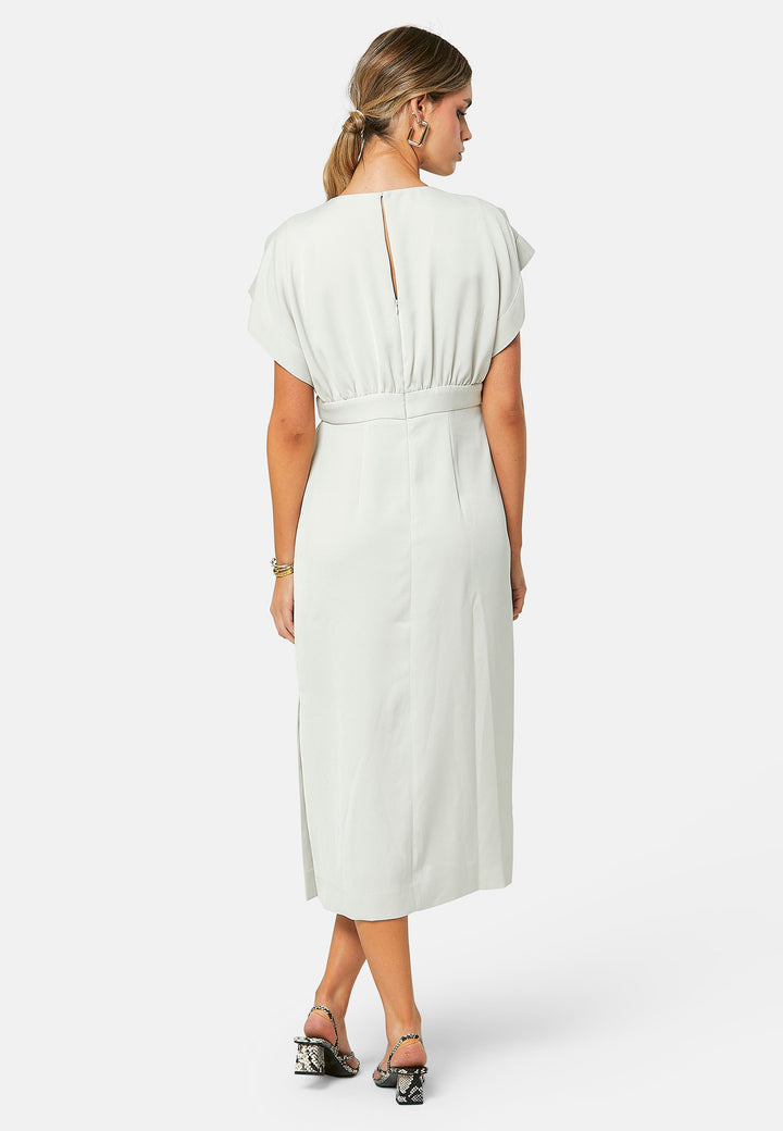 Elevate your wardrobe with Shiv, a simple stone midi dress in a fluid satin back crepe. Featuring dropped sleeves, a gathered back waist seam, and a side slit for ease of movement. The back has a keyhole detail with a button closure.