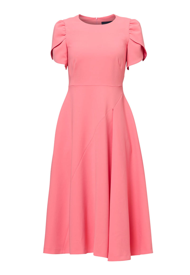 The Vera Poney Pink Dress is perfect for special occasions. It features a flattering fit-and-flare silhouette and short gathered sleeves with an elegant overlapping detail. The mid-calf length skirt flares out gracefully, adding elegance to the dress. Crafted from a comfortable fabric blend, it ensures ease of movement and a polished look.