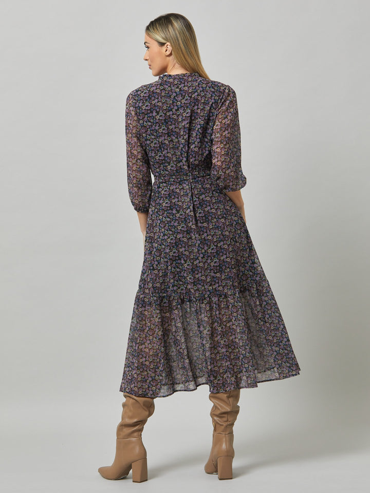 Opt for beverly, the ultimate transeasonal dress. Crafted in a breathable viscose georgette with an irregular multi-coloured dot print. The design is rooted in simplicity with a cross over v-neckline and flattering waist ties. The voluminous semi-sheer sleeves subtly balance the traditional design for a fresh, feminine look