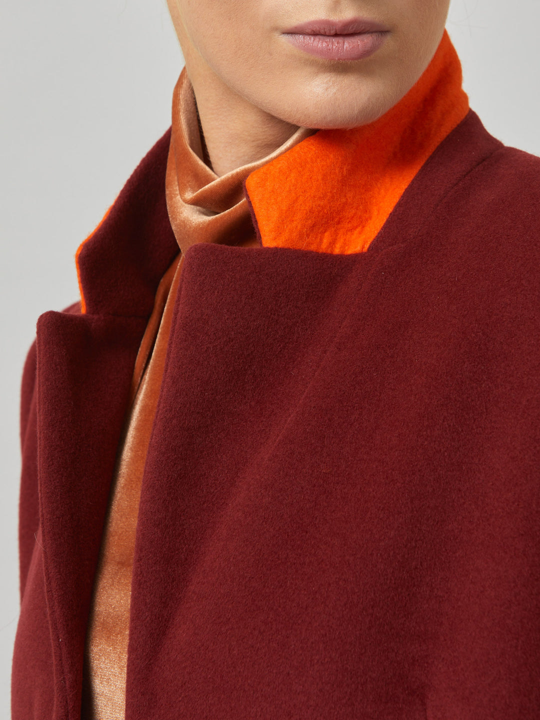 Lisa, practical winter glamour at its finest. Crafted in a warm russet red melton with a tidy collar & revere. Lisa features handy jeet pockets & concealed buttons. This knee-length coat ensures stylish winter warmth.