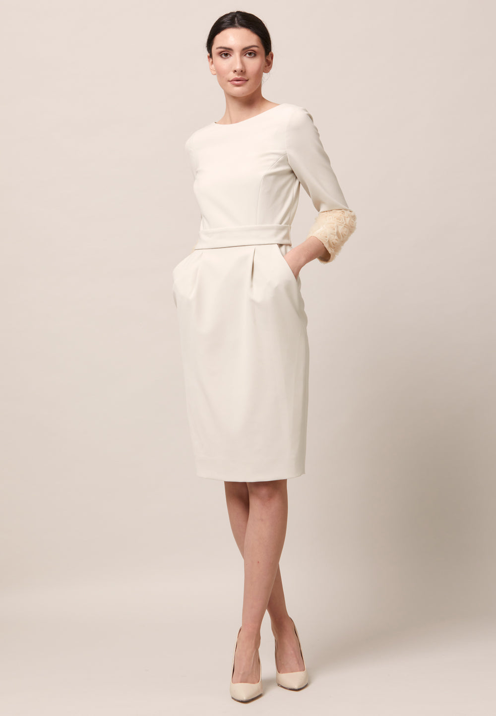 Dianna is the answer to any occasion invite. An elegant dress with a sculptured petal detail cuff. An expertly tailored form-flattering silhouette with pockets, detachable belt & pencil skirt which falls to mid-calf. Crafted from sustainably sourced fibers with a hint of stretch to ensure comfort & ease of movement. Heighten the drama of this piece with your favourite accessories and heels.