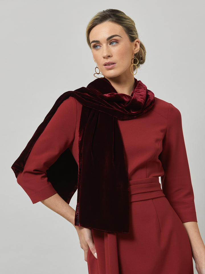 Rema, a warm russet red body-con dress. Features an elegant asymmetric vee neckline which is echoed in it's detachable no -fuss obi belt. The elastic in the fabric ensures comfort and ease of movement. Elegant and timeless with relaxed mood for the modern woman. 