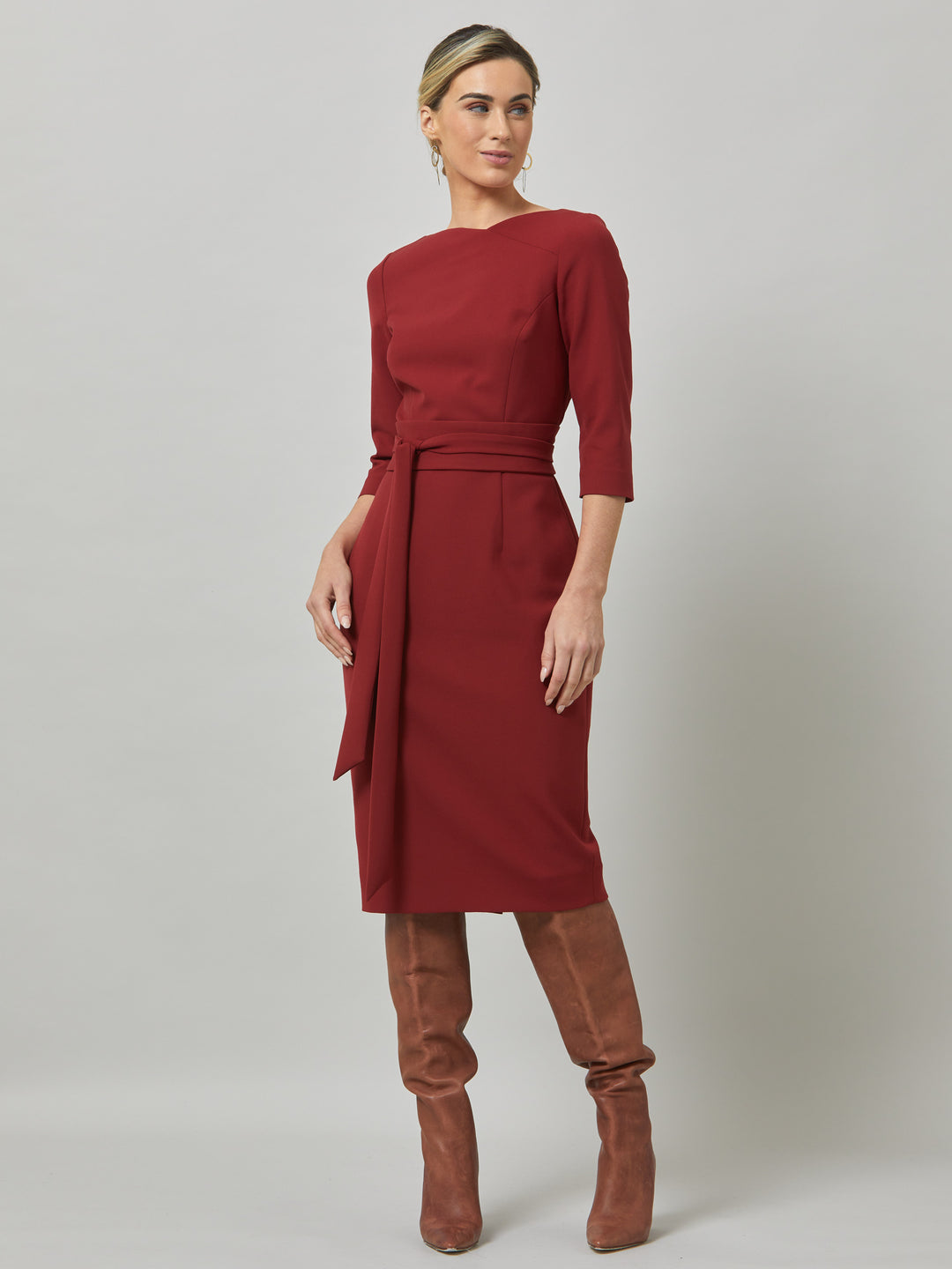 Rema, a warm russet red body-con dress. Features an elegant asymmetric vee neckline which is echoed in it's detachable no -fuss obi belt. The elastic in the fabric ensures comfort and ease of movement. Elegant and timeless with relaxed mood for the modern woman. 