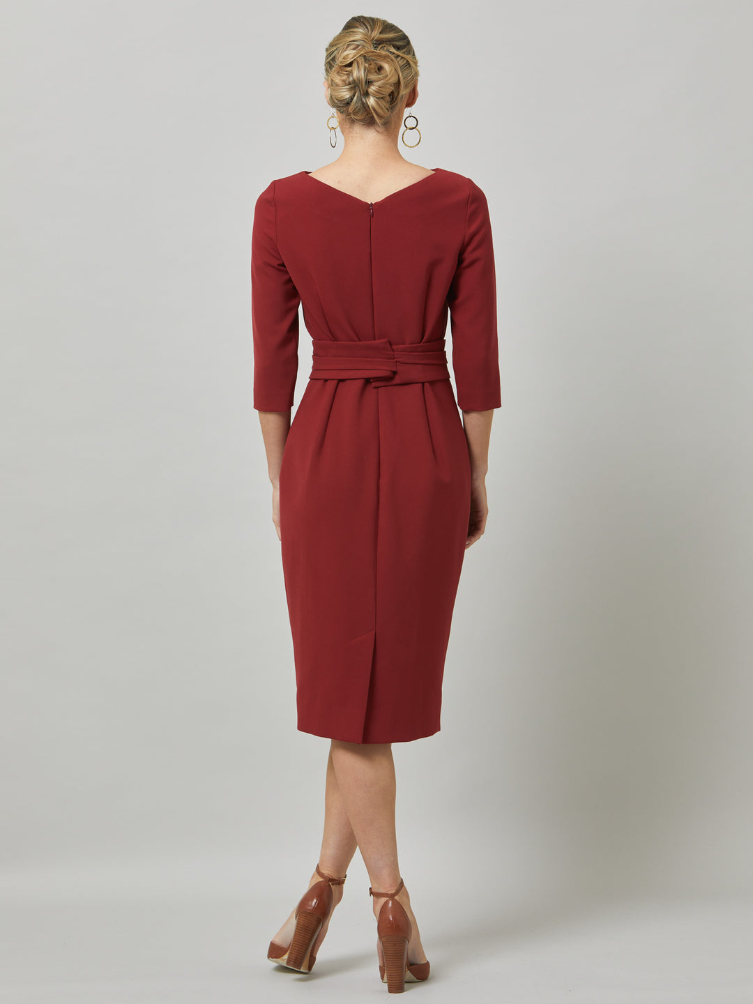 Rema, a warm russet red body-con dress. Features an elegant asymmetric vee neckline which is echoed in it's detachable no -fuss obi belt. The elastic in the fabric ensures comfort and ease of movement. Elegant and timeless with relaxed mood for the modern woman. 