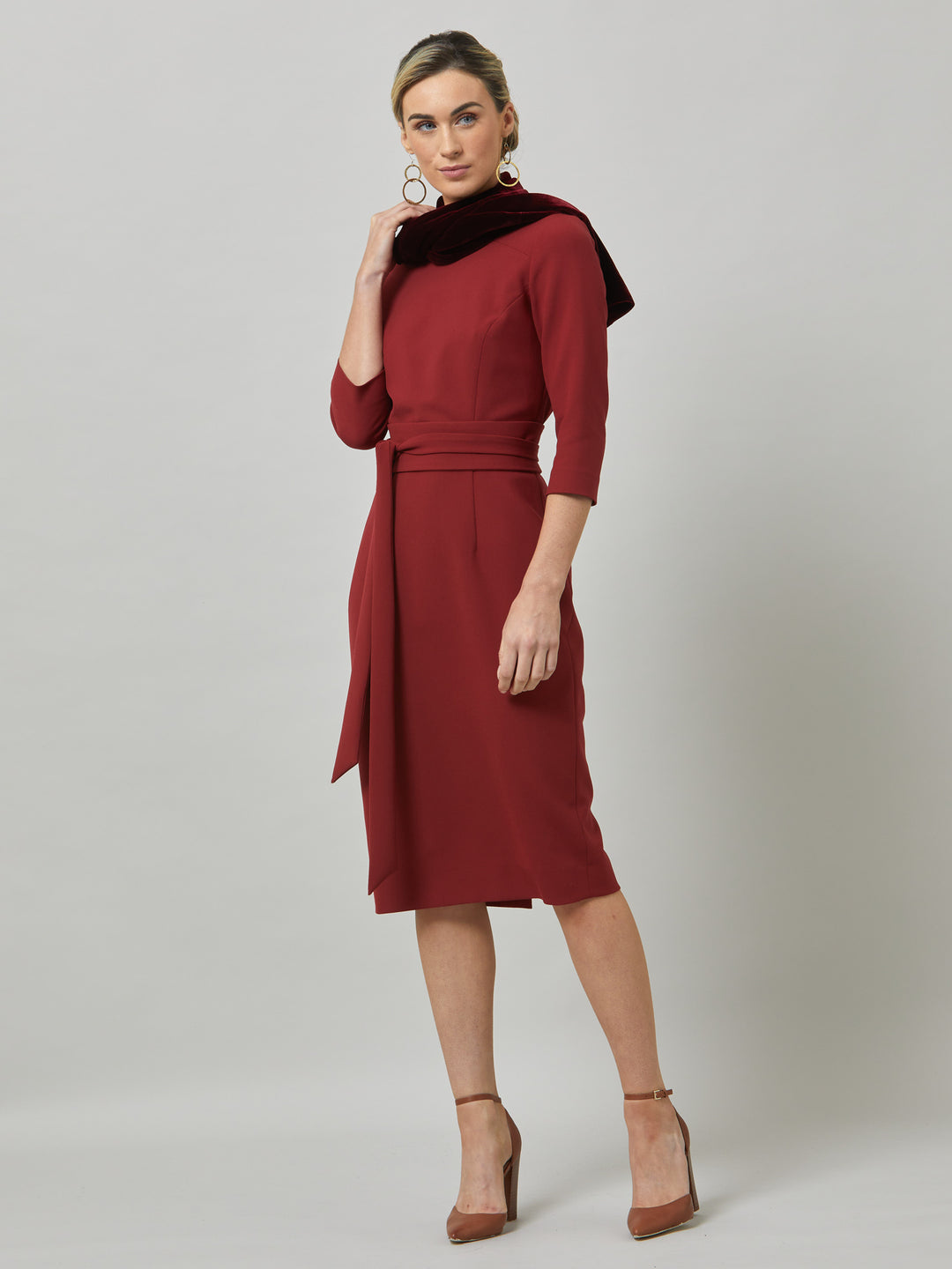 Rema, a warm russet red body-con dress. Features an elegant asymmetric vee neckline which is echoed in it's detachable no -fuss obi belt. The elastic in the fabric ensures comfort and ease of movement. Elegant and timeless with relaxed mood for the modern woman. 